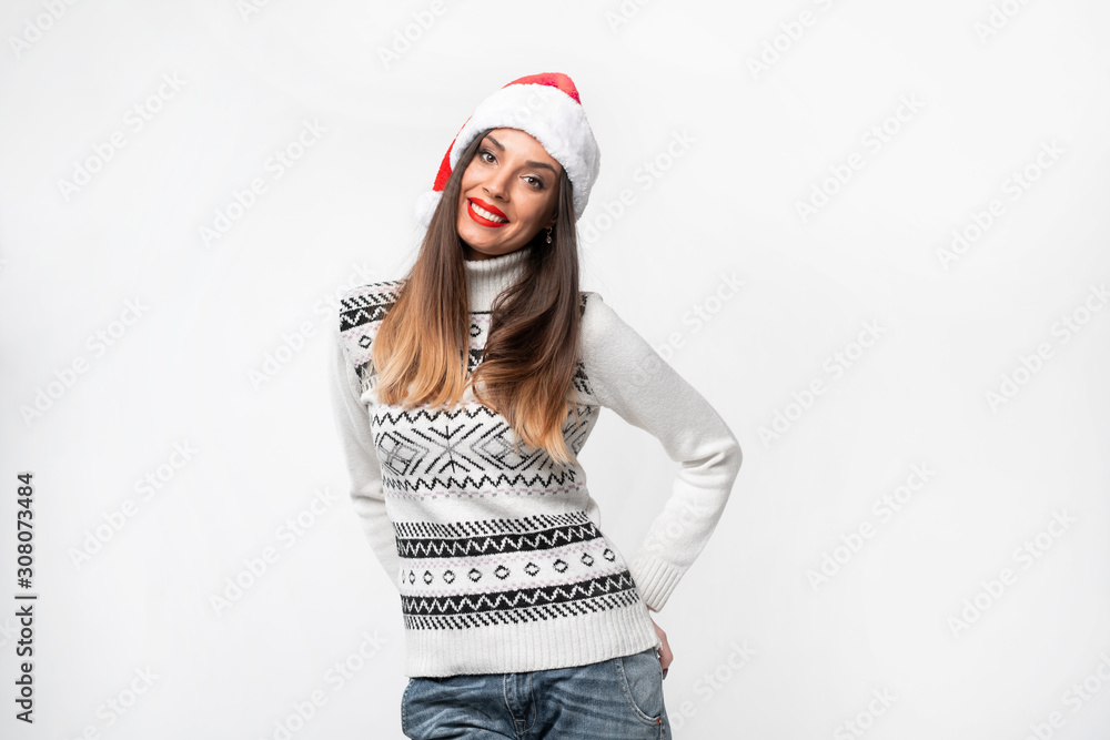 Close up portrait beautifiul caucasian woman in red Santa hat on white studio background. Christmas and New Year holiday concept. Close up portrait beautifiul caucasian woman in red Santa hat on white studio background. Christmas and New Year holiday concept.