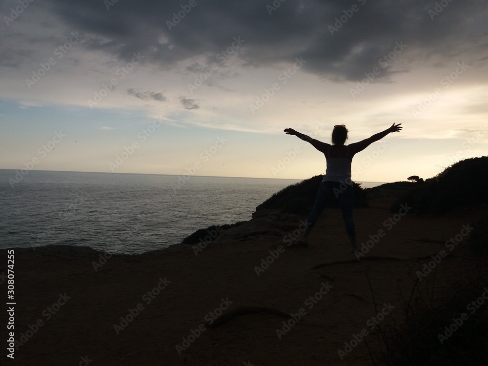 silhouette of man on top of mountain