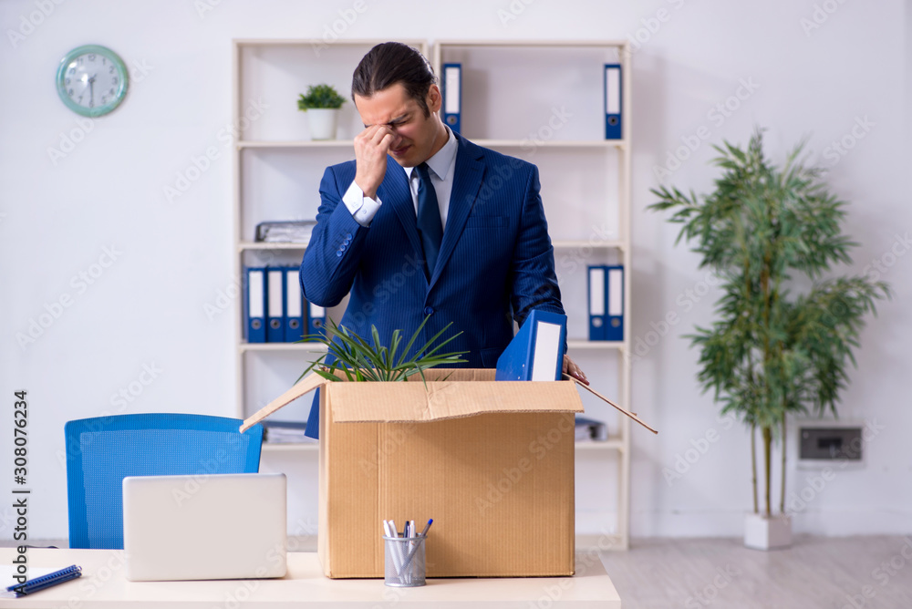 Young employee being made redundant