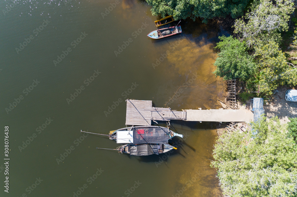 Aerial view top down High angle view drone shot of the longtail fishing boats in canal.