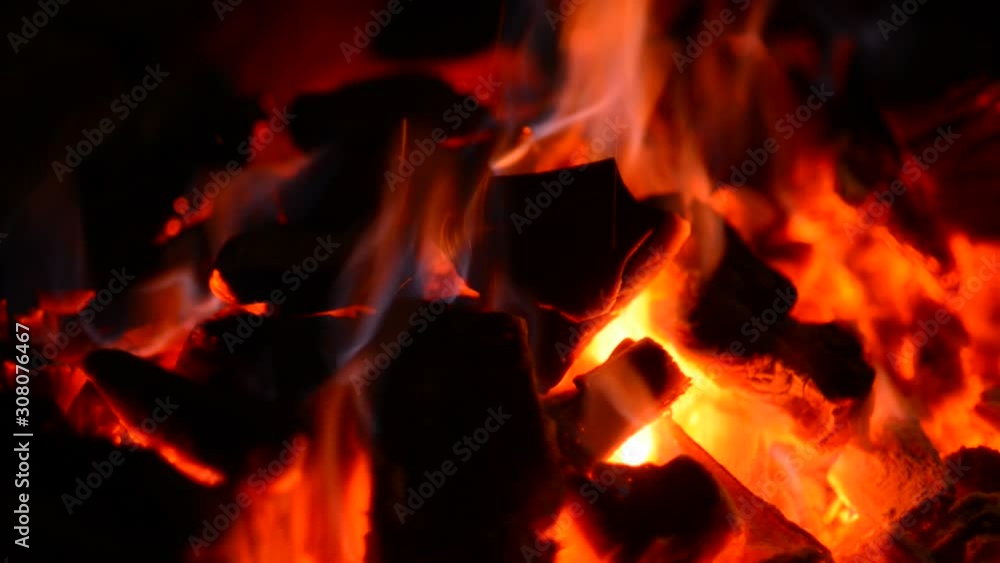 close up bonfire flames of camping fire, Super slow motion burning firewood. close up bonfire flames of camping fire, Super slow motion burning firewood.
