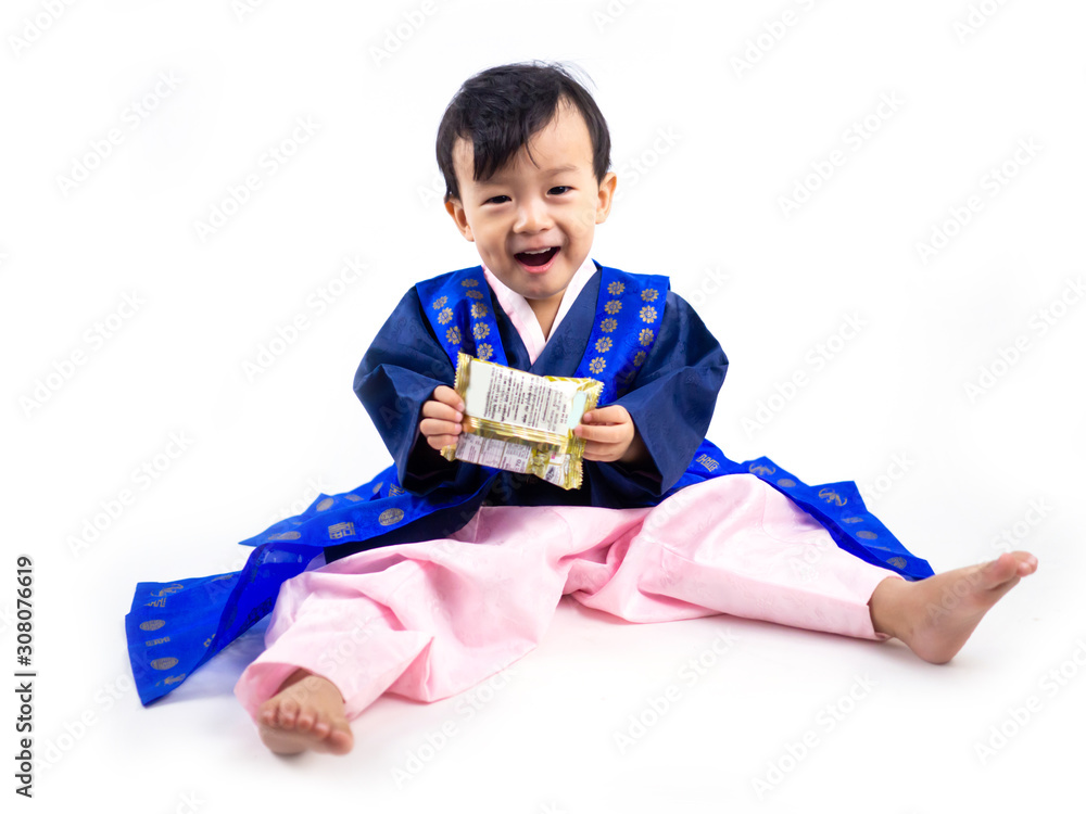 Asian little boy wearing a Korean Traditional Hanbok dress in white background Asian little boy wearing a Korean Traditional Hanbok dress in white background