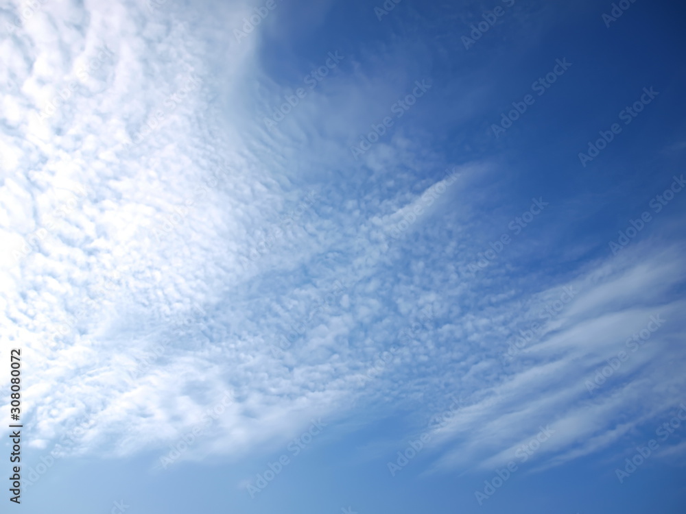 Beautiful thin white clouds on a blue sky background