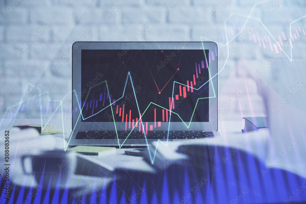 Stock market chart hologram drawn on personal computer background. Double exposure. Concept of investment. Stock market chart hologram drawn on personal computer background. Double exposure. Concept of investment.