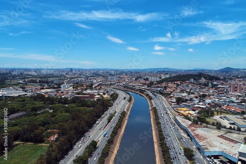 Aerial view of river between roads. Cityscape scenery. Great landscape. Marginal Tietê, São Paulo, Brazil