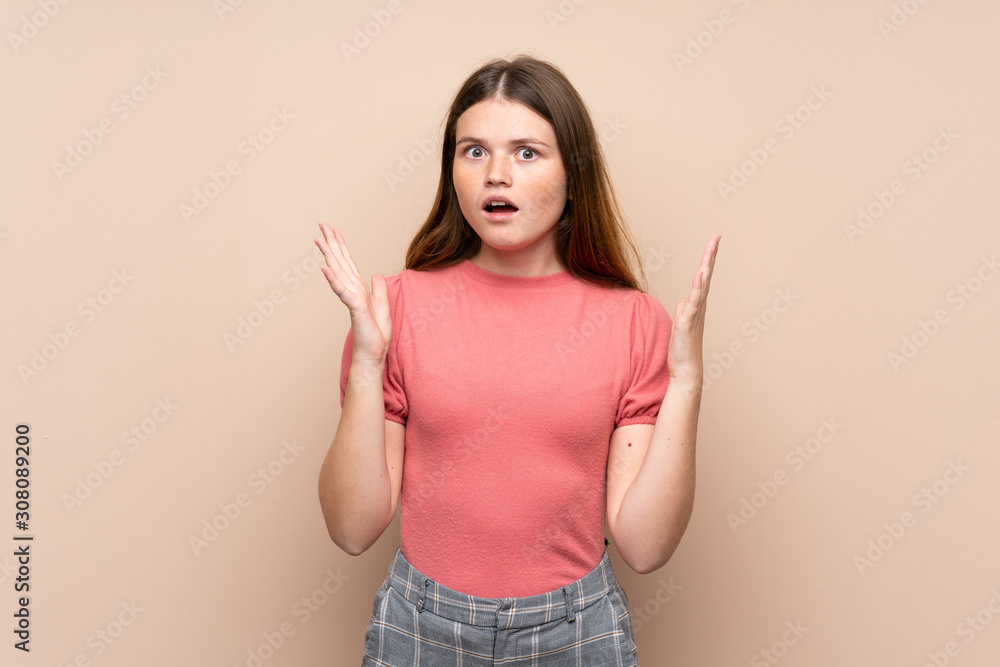 Ukrainian teenager girl over isolated background with surprise facial expression Ukrainian teenager girl over isolated background with surprise facial expression