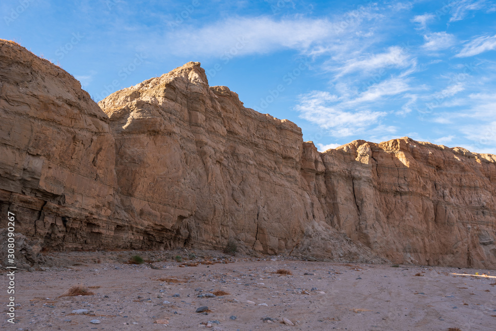 Landscape of desert and large barren stone hillside at Mecca Wilderness in Southern California 