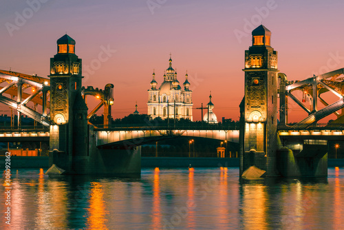 The old Smolny Cathedral in the alignment of the Bolsheokhtinsky bridge on a June night. Saint-Petersburg, Russia photo