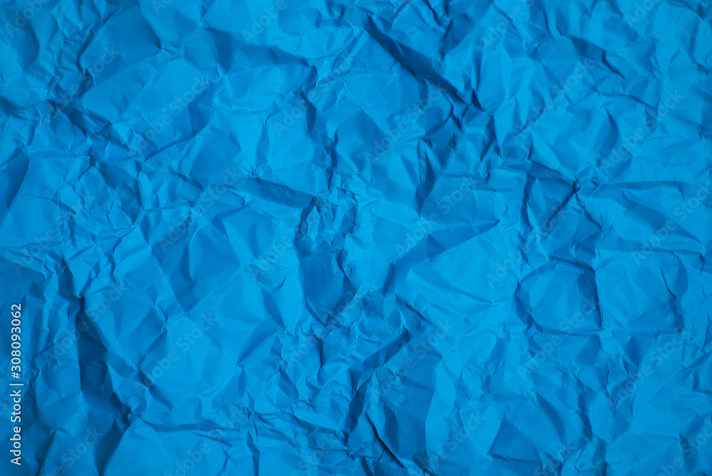 Obraz premium Blue paper crease texture background.
