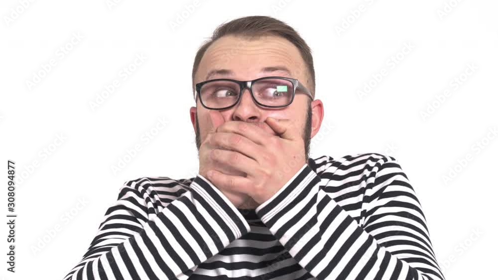 Young man with surprised facial expression with opened mouth. Close-up headshot portrait of shocked man with his hand on the face. Young man with surprised facial expression with opened mouth. Close-up headshot portrait of shocked man with his hand on the face.