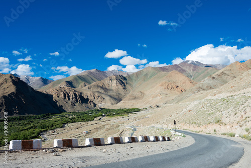 Ladakh, India - Aug 03 2019 - Riders on Between Khardung La Pass (5359m) and Leh in Ladakh, Jammu and Kashmir, India. photo