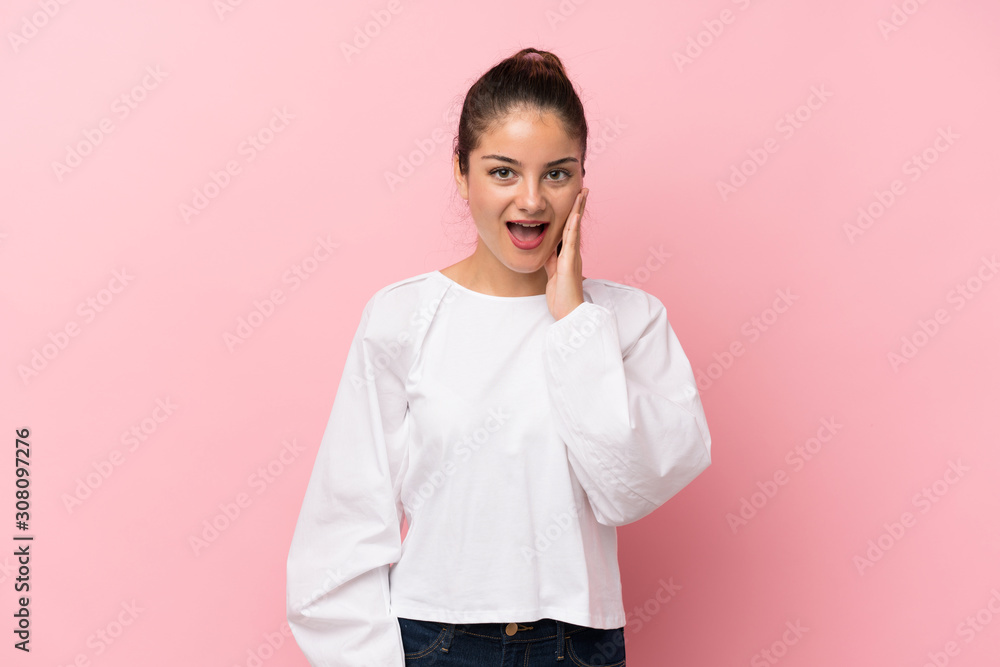 Young brunette girl over isolated pink background with surprise and shocked facial expression Young brunette girl over isolated pink background with surprise and shocked facial expression