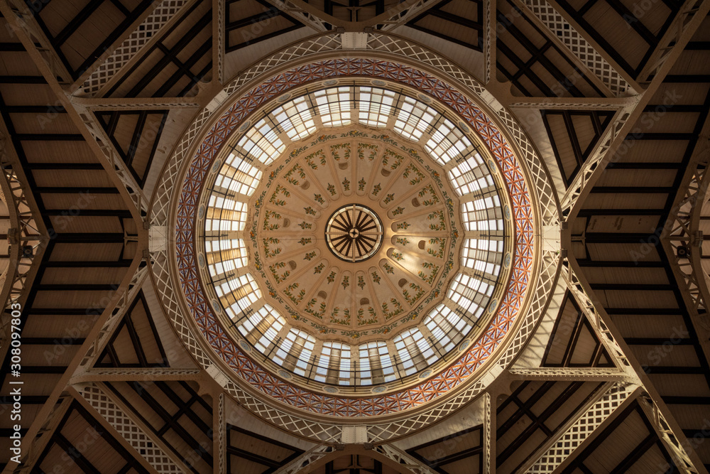 Interior view of the dome of the central market of Valencia in beautiful light, Spain