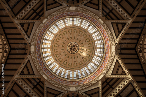 Interior view of the dome of the central market of Valencia in beautiful light, Spain