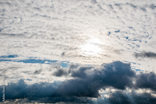 the sun's rays shine through the clouds. cloudy sky, background