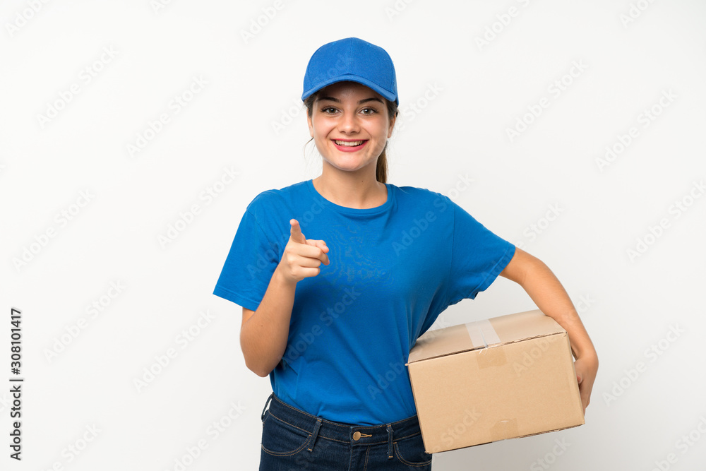 Young delivery girl over isolated white background points finger at you Young delivery girl over isolated white background points finger at you