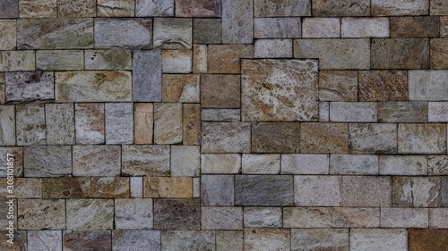 Background texture image of wall covered with rough tiles.