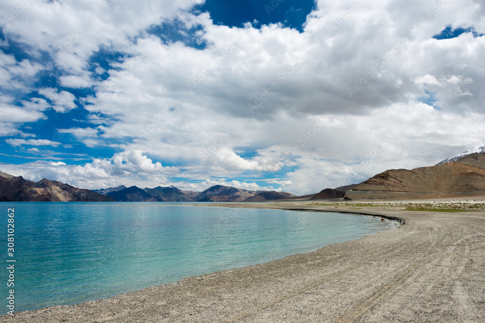 Fototapeta premium Ladakh, India - Aug 05 2019 - Pangong Lake view from Between Maan and Merak in Ladakh, Jammu and Kashmir, India. The Lake is an endorheic lake in the Himalayas situated at a height of about 4350m.