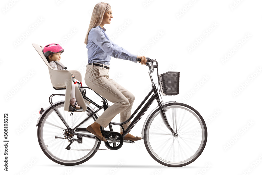 Mother riding a bicycle with a child in a seat Mother riding a bicycle with a child in a seat