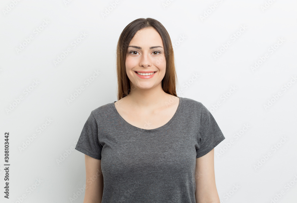 Portrait of a beautiful young woman. Smiling happy girl on a white background. Portrait of a beautiful young woman. Smiling happy girl on a white background.