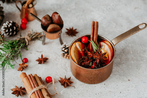 Fototapeta Naklejka Na Ścianę i Meble -  Mulled wine hot drink with citrus and spices, hot drink, winter concept, Christmas season