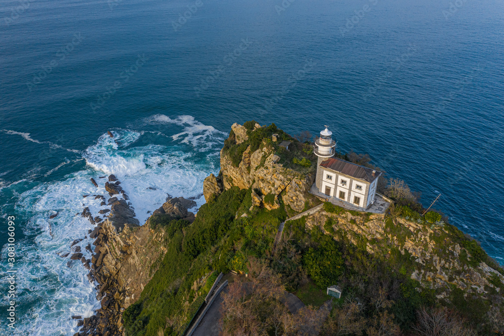 Getaria lighthouse at dusk, Basque country - drone aerial view