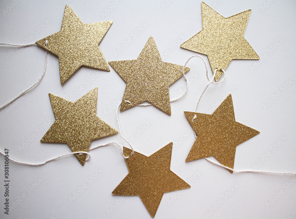 garland of golden stars. flat lay style. xmas holiday theme garland of golden stars. flat lay style. xmas holiday theme