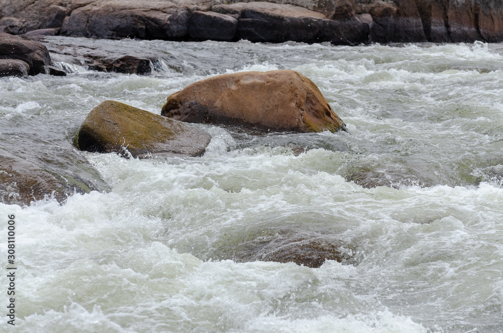 Fototapeta premium Rapid moving water at Pabineau Falls, New Brunswick, Canada