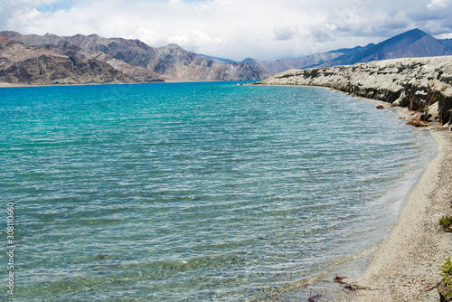 Ladakh, India -Aug 06 2019 - Pangong Lake view from Between Kakstet and Chushul in Ladakh, Jammu and Kashmir, India. The Lake is an endorheic lake in the Himalayas situated at a height of about 4350m. photo