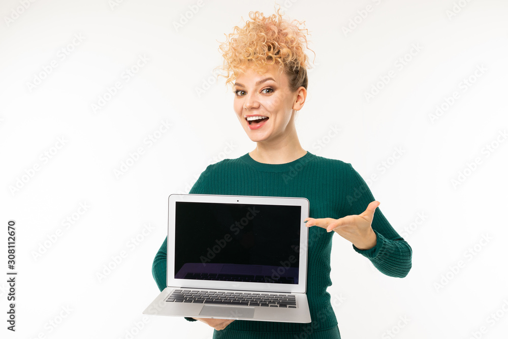 lovely curly girl holding a notebook with mockup in her hands on a white studio background lovely curly girl holding a notebook with mockup in her hands on a white studio background