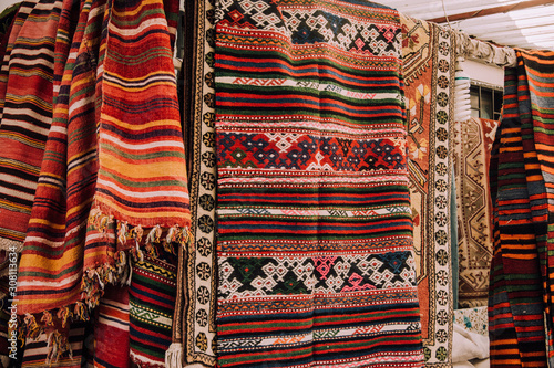 Sell-out. Market in Bodrum. Authentic traditional turkish rugs. Patterns on the carpets. Ethno style. Comfort. Home decoration. Embroidery. Carpet for the floor.Turkish carpet.
