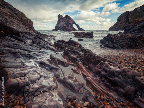 The view from the rocky shore to the Bow Fiddle Rock, Portknockie, Scotland