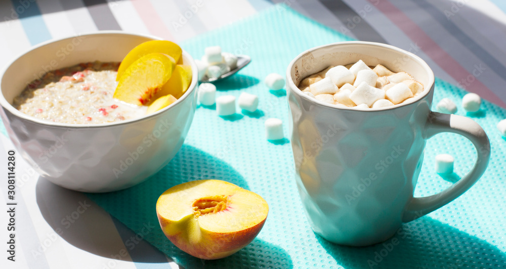 Cereals with milk and fruits. Hot chocolate with marshmallows Cereals with milk and fruits. Hot chocolate with marshmallows
