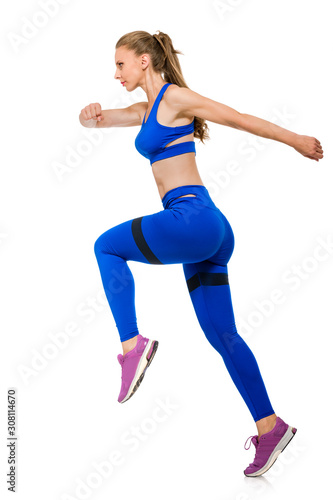 Side view photo of fit healthy woman running on white background © Denys Kurbatov