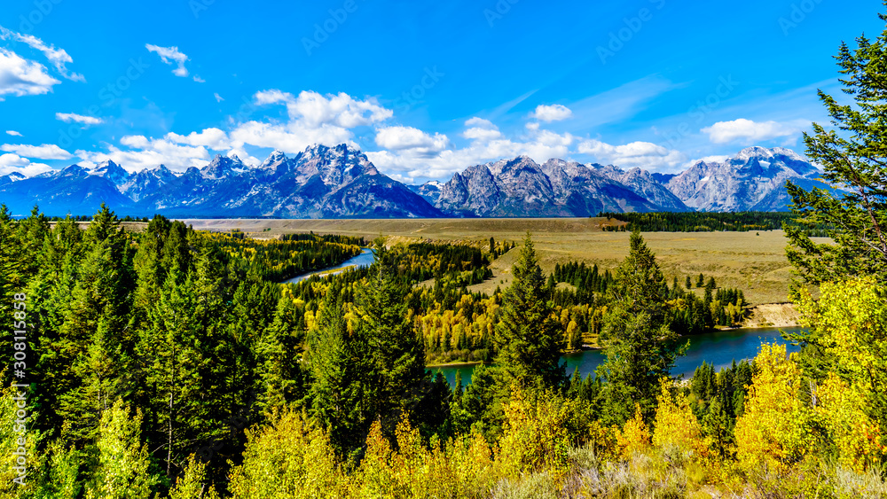 The peaks of The Grand Tetons behind the winding Snake River viewed from the Snake River Overlook on Highway 191 in Grand Tetons National Park, Wyoming, United States