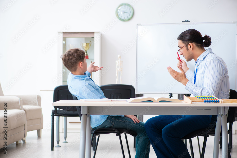 Young father helping his son to prepare for exam Young father helping his son to prepare for exam