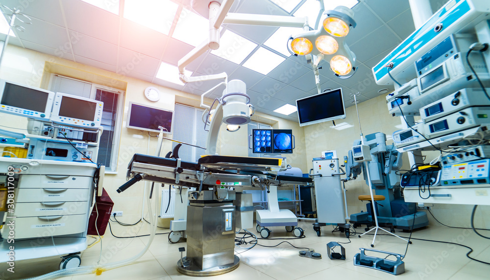 Modern operating room with advanced equipment, special medical devices, hospital room interior. Modern operating room with advanced equipment, special medical devices, hospital room interior.