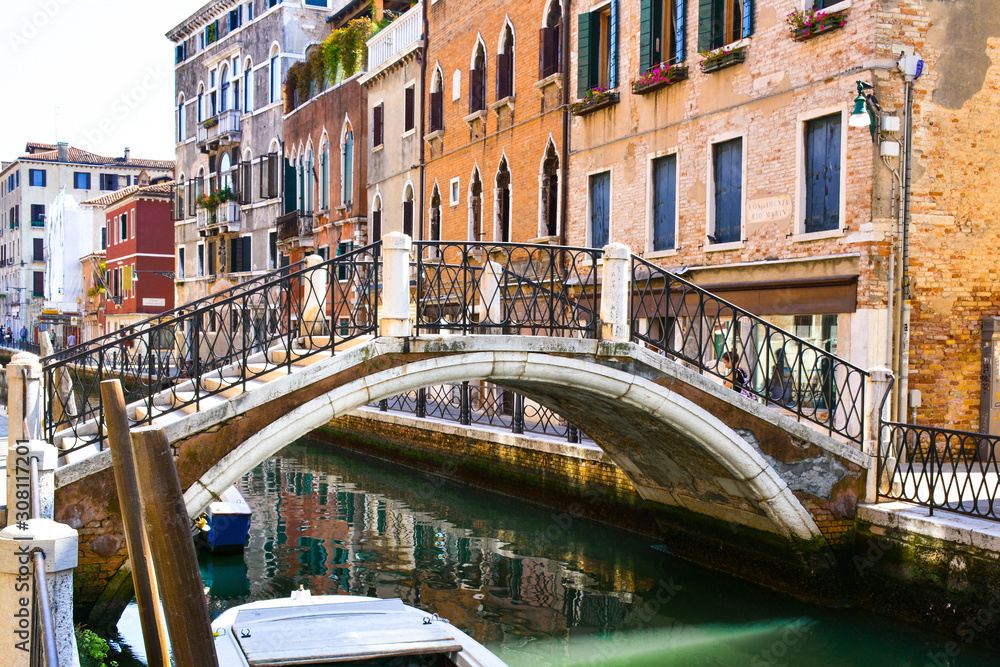 old stone bridge over canal in venice