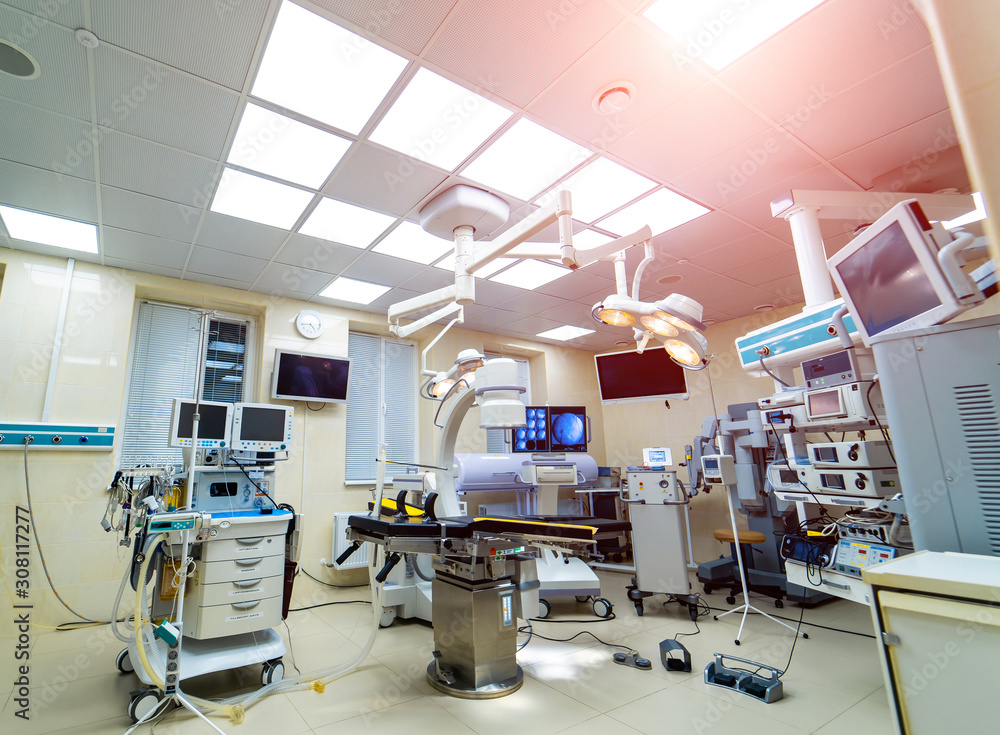 Interior of operating room in modern clinic, lamps and ultra modern devices, technology in modern clinic.