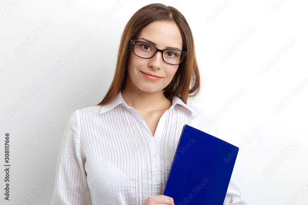 Portrait of a beautiful business woman manager in glasses with documents in hands. Portrait of a beautiful business woman manager in glasses with documents in hands.