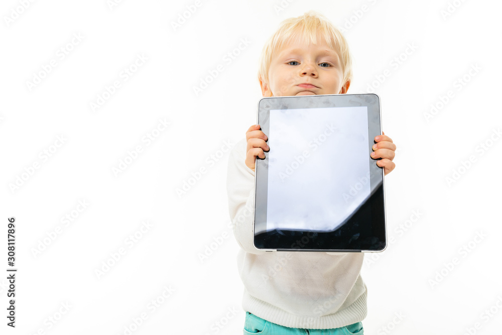 Little blonde caucasian boy shows the tablet isolated on white background Little blonde caucasian boy shows the tablet isolated on white background