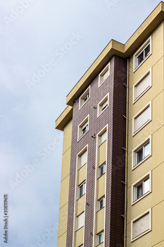Vertical frame bottom clear shoot of mass housing dark yellow facade color building