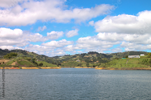 Landscape of agricultural Colombia with white fluffy clouds