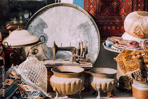 To sell out.Market in Bodrum. Authentic counter.Old turkish decor Carpets,teapots,sewing machine.Flea market in Turkey.Second hand in Bodrum.Antique store. photo