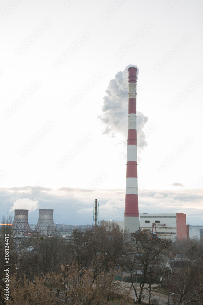 Pollution of the environment, with the pipe smoke in the background of clear sky Pollution of the environment, with the pipe smoke in the background of clear sky