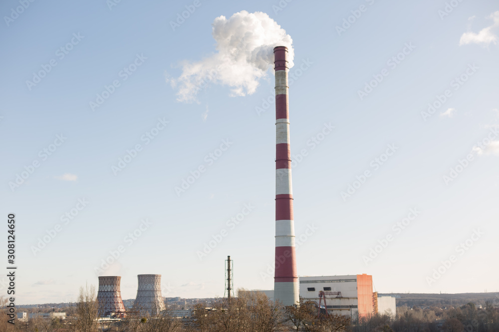 Pollution of the environment, with the pipe smoke in the background of clear sky Pollution of the environment, with the pipe smoke in the background of clear sky