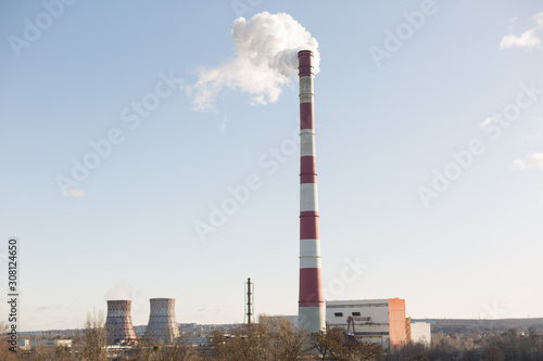 Pollution of the environment, with the pipe smoke in the background of clear sky