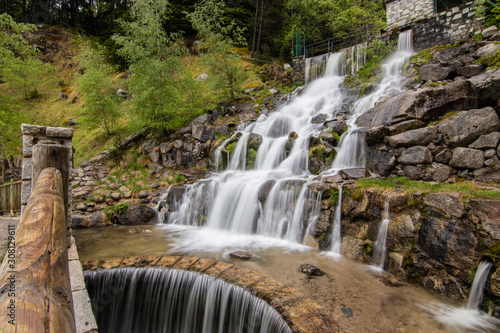 A small cascade waterfall  near a village of Encamp  Andorra. Located in the Pyrenees mountain