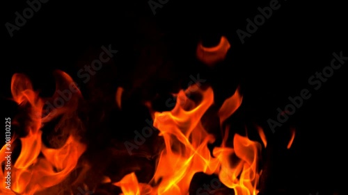 Slow motion fire flame, super slow hot power of bon fire on dark night background, red orange flame glowing and blazing  photo