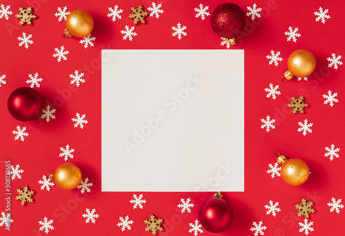 Christmas mockup with snowflakes and gold and red balls on a red background. Happy new year. Space for text. Winter concept.